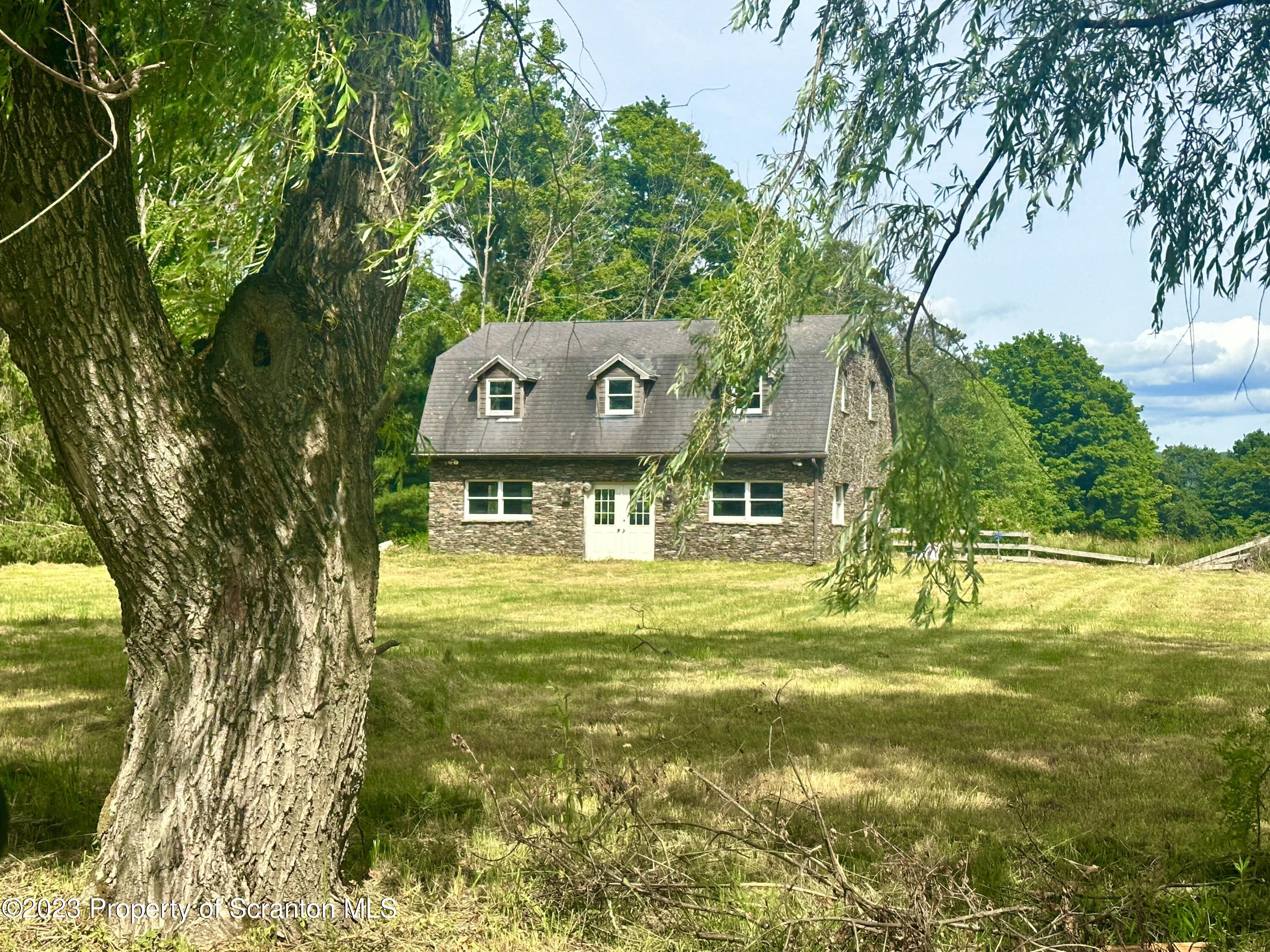 a swimming pool with an outdoor space and seating area