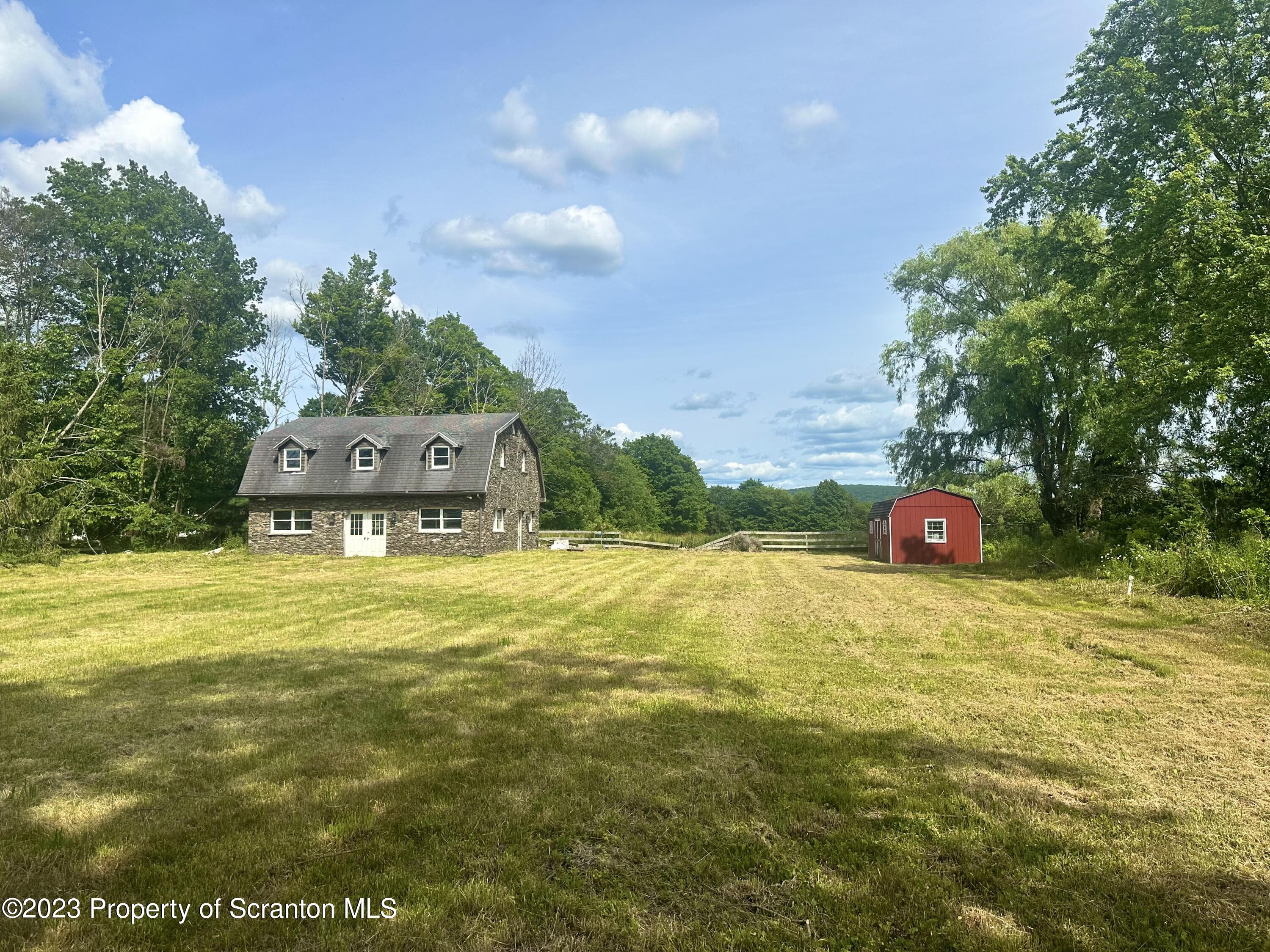 Silver Maple Drive Clarks Summit, PA 18411 - Photo 2 of 8 a swimming pool with trees in the background
