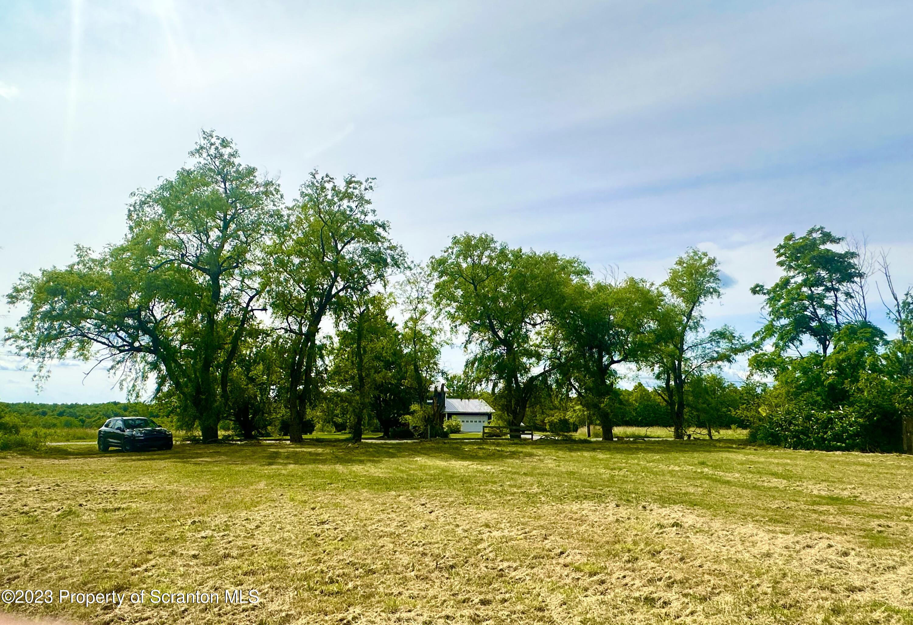 Silver Maple Drive Clarks Summit, PA 18411 - Photo 5 of 8 a view of a swimming pool with an outdoor space and seating area