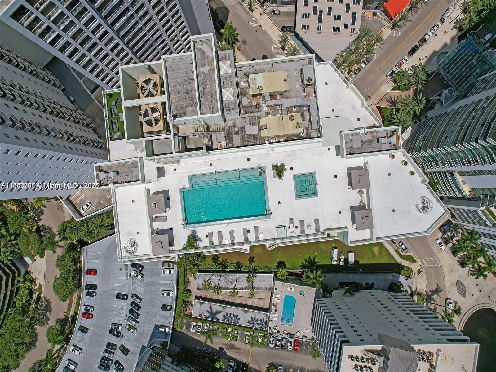 218 Southeast 14th Street, Unit 1407 Miami, FL 33131 - Photo 2 of 7 an aerial view of a building with street view