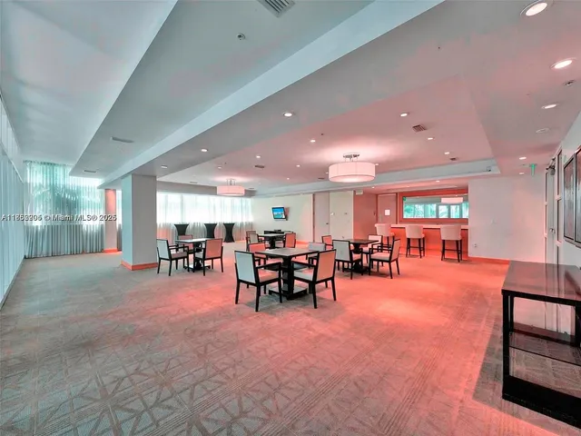 a living room with furniture and a table with projector