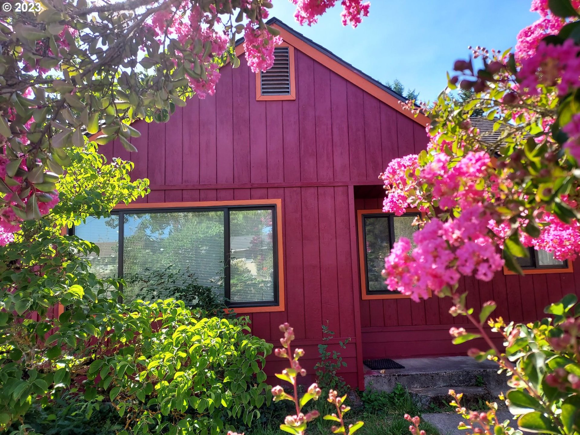 460 37th Street Springfield, OR 97478 - Photo 3 of 21 a front view of a house with a lot of flowers