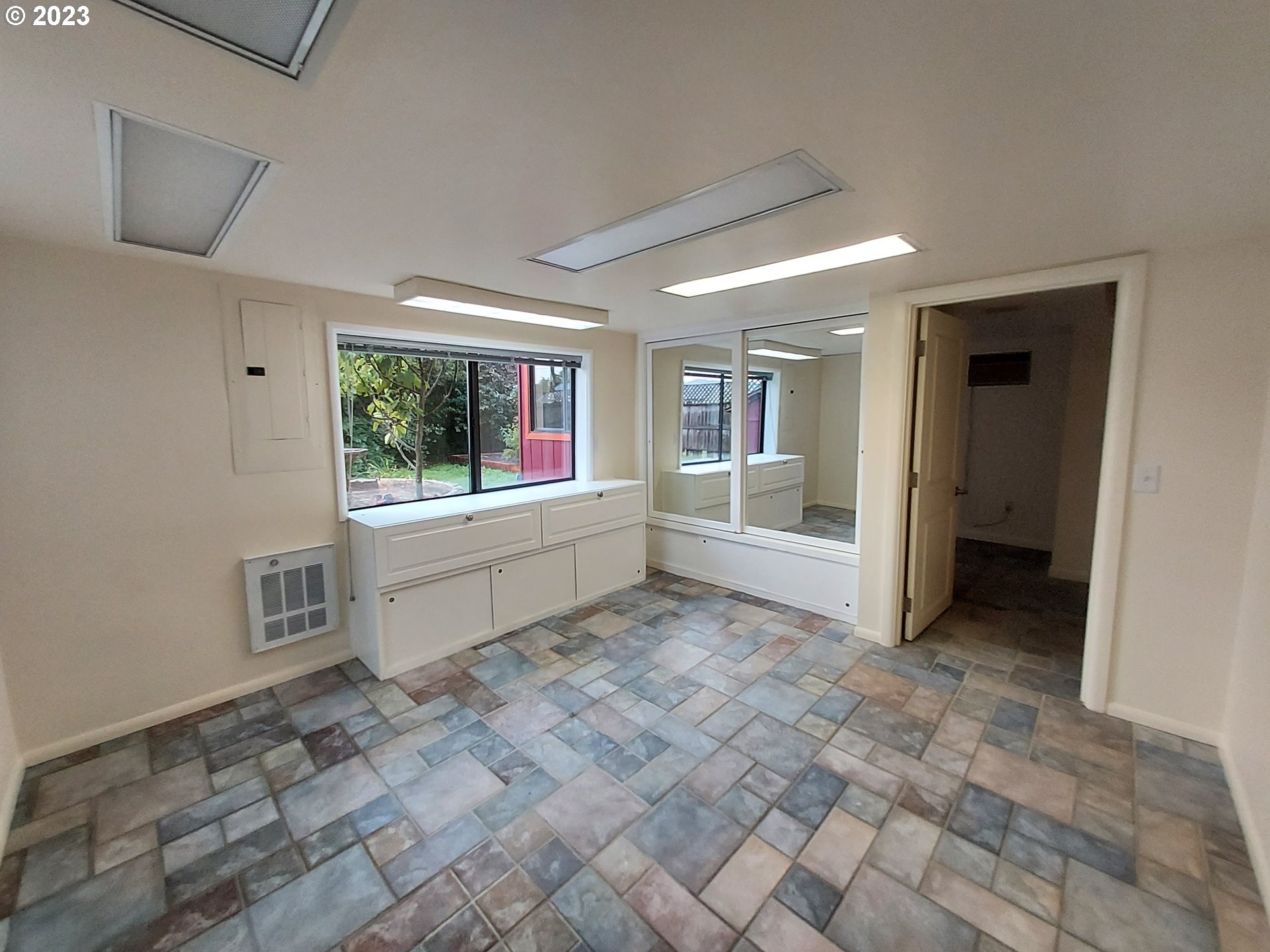 460 37th Street Springfield, OR 97478 - Photo 9 of 21 a view of an empty room with a window
