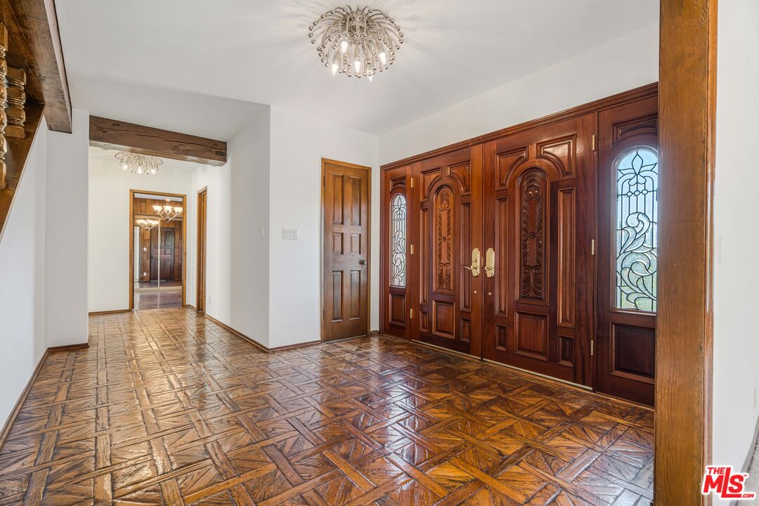 1181 Somera Road Los Angeles, CA 90077 - Photo 3 of 40 a view of an entryway with a chandelier