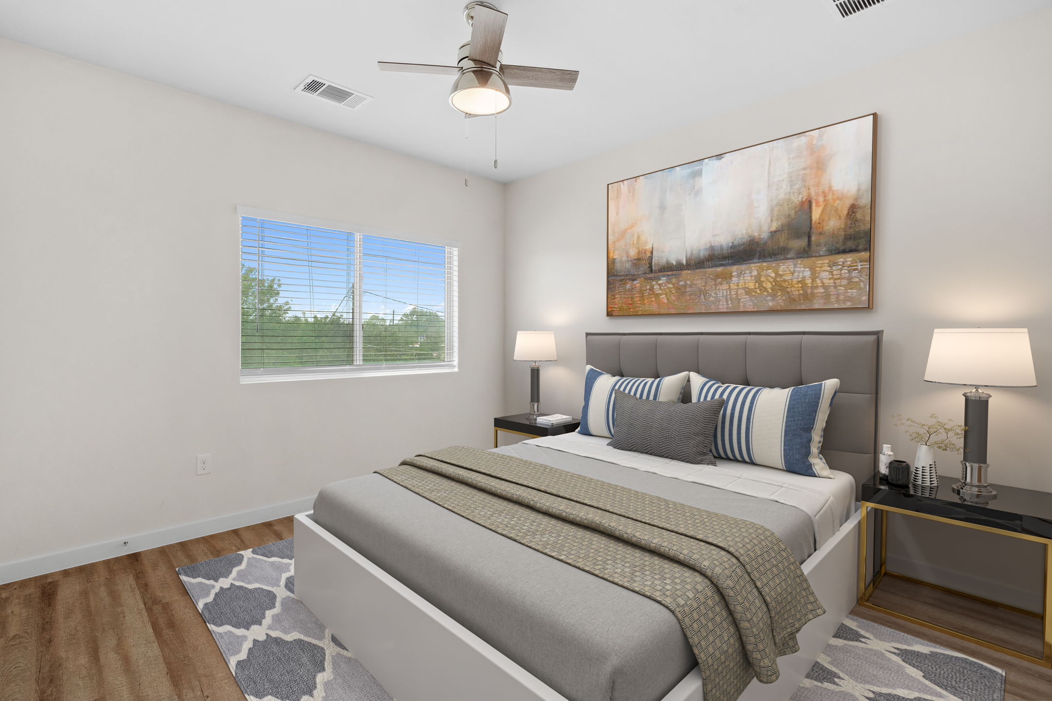 7805 Cooper Lane, Unit 606 Austin, TX 78745 - Photo 23 of 35 a bedroom with a bed and a painting on the wall