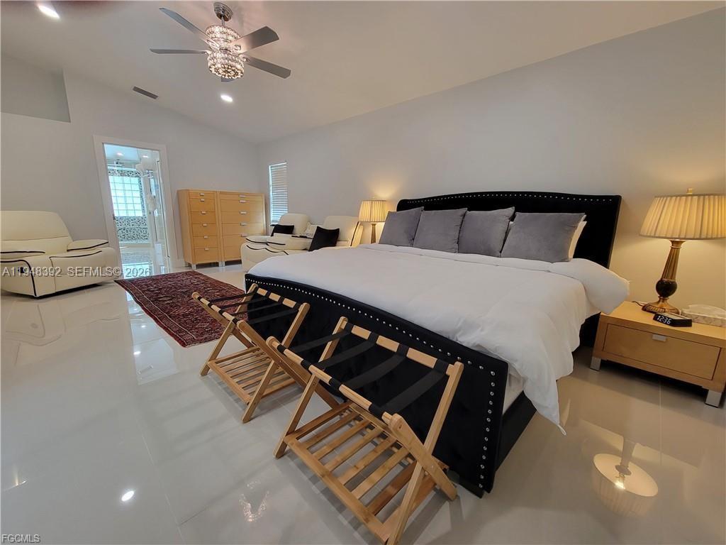 237 Southwest 47th Street Cape Coral, FL 33914 - Photo 20 of 50 a bedroom with a bed and window