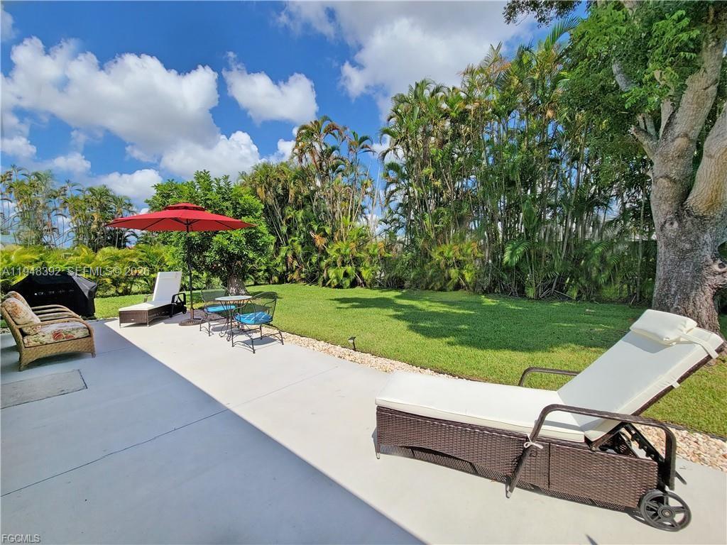 237 Southwest 47th Street Cape Coral, FL 33914 - Photo 2 of 50 a view of a backyard with sitting area
