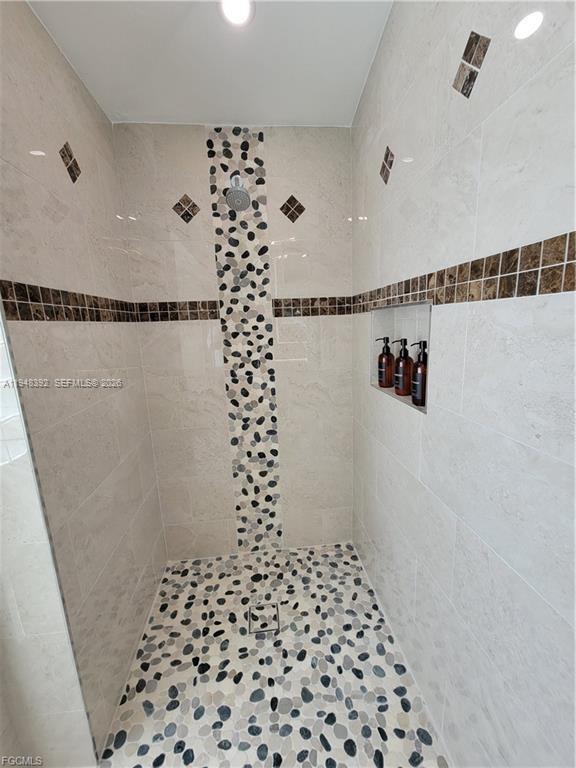 237 Southwest 47th Street Cape Coral, FL 33914 - Photo 30 of 50 a bathroom with a shower and a sink
