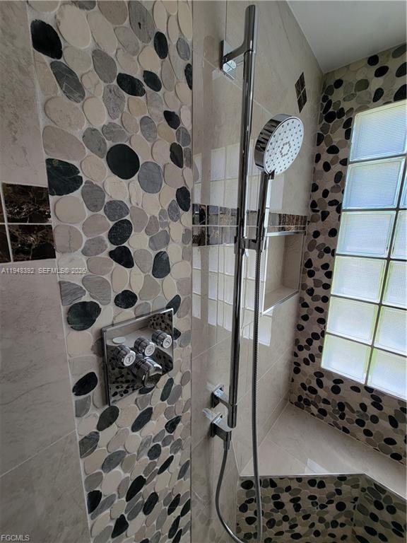 237 Southwest 47th Street Cape Coral, FL 33914 - Photo 31 of 50 a bathroom with a shower and a sink