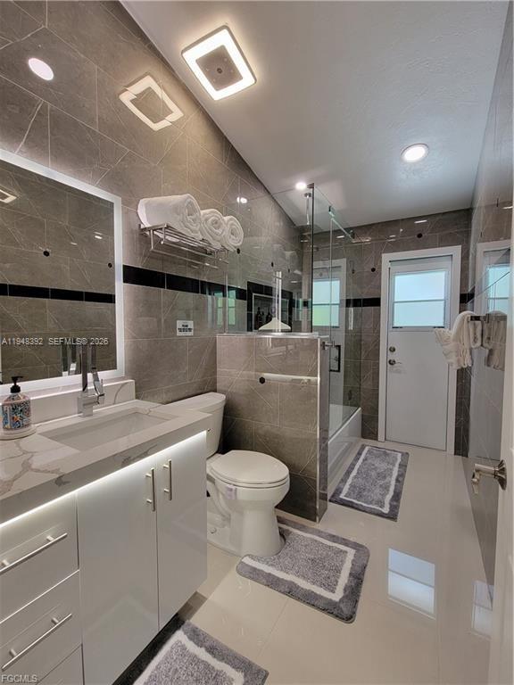 237 Southwest 47th Street Cape Coral, FL 33914 - Photo 37 of 50 a bathroom with a toilet sink and mirror