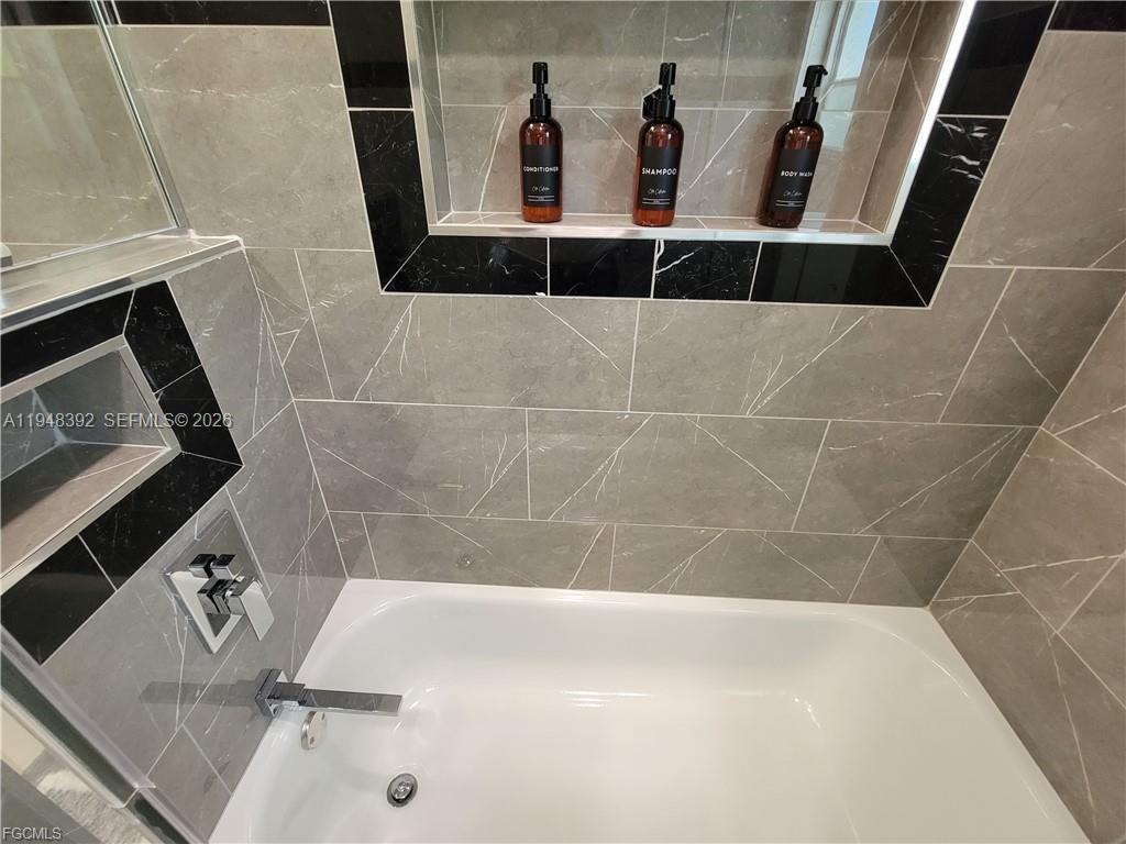 237 Southwest 47th Street Cape Coral, FL 33914 - Photo 40 of 50 a bathroom with a bathtub
