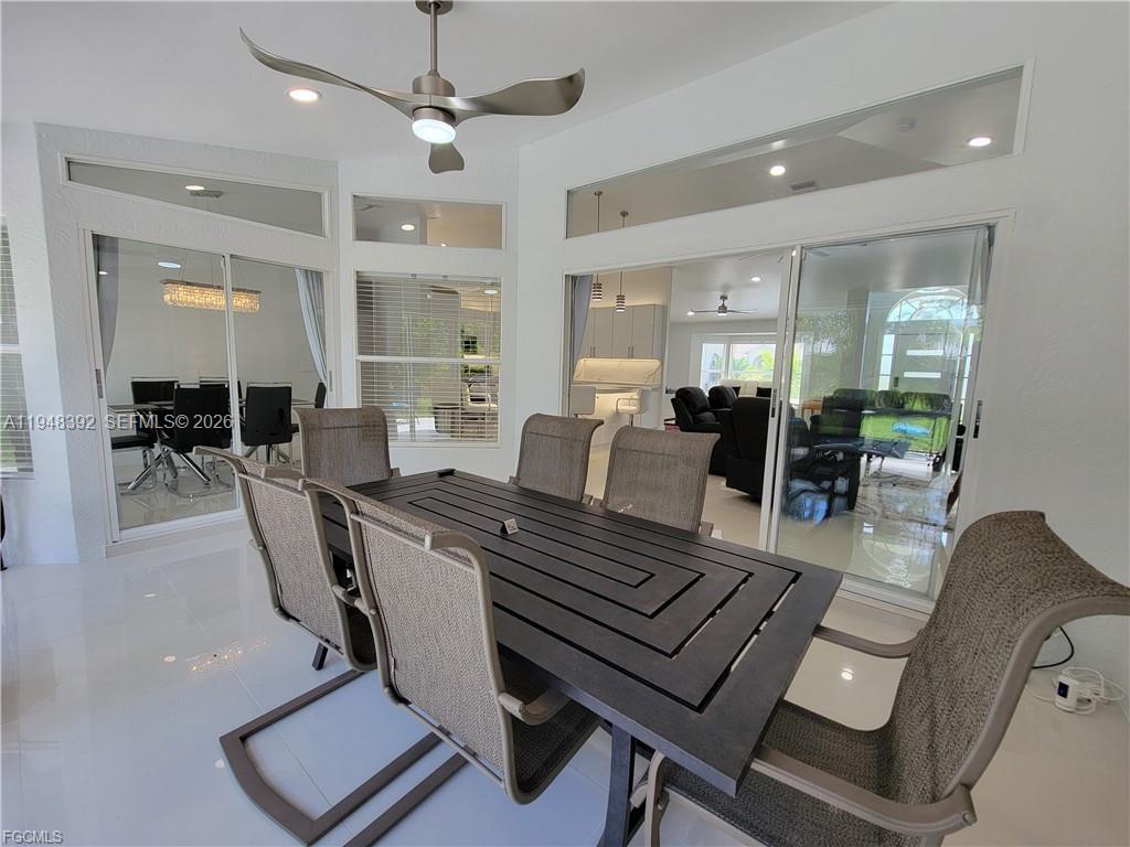 237 Southwest 47th Street Cape Coral, FL 33914 - Photo 45 of 50 a living room with furniture a table and chairs