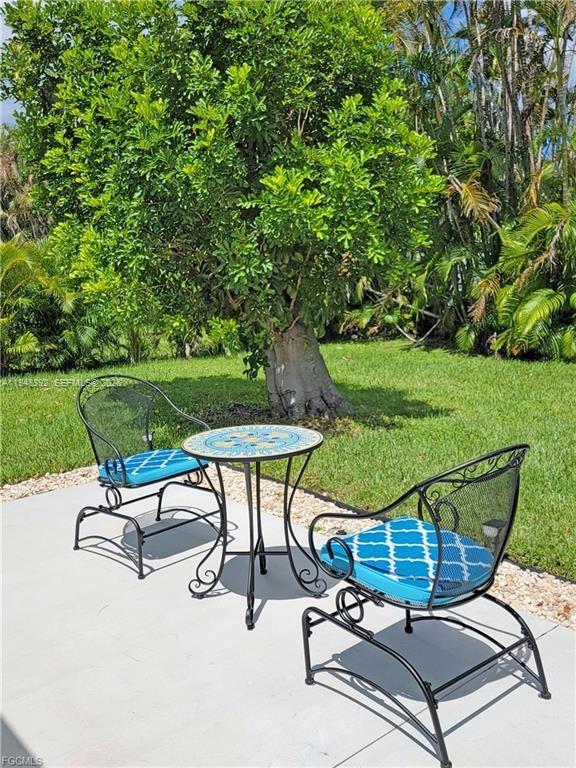 237 Southwest 47th Street Cape Coral, FL 33914 - Photo 47 of 50 a view of a backyard with sitting area