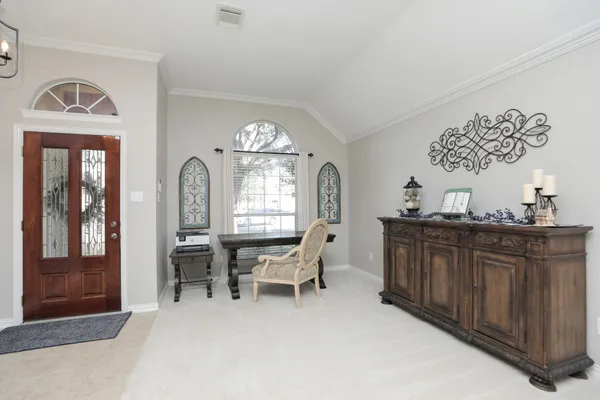 a view of a dining room with furniture window and outside view