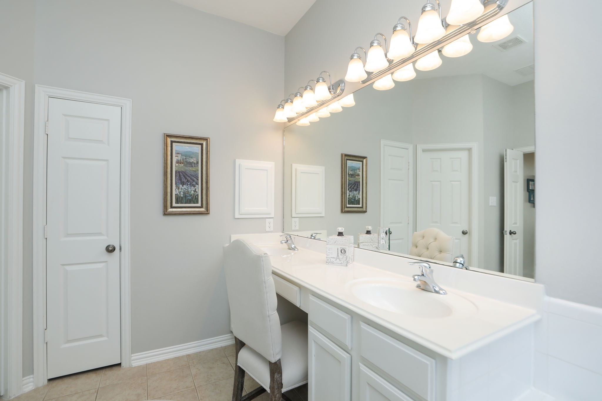 1214 Berwick Manor Court Spring, TX 77379 - Photo 31 of 49 Fresh paint in soft tone. Double sinks and medicine cabinet. Soft lighting. and linen closet