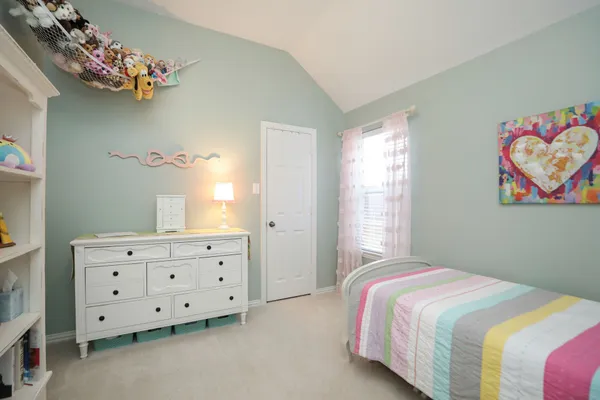a bedroom with a bed and closet