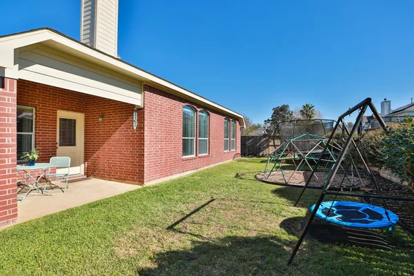 a view of a backyard with sitting area