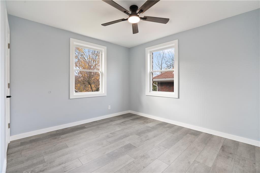 3030 Shady Avenue Pittsburgh, PA 15217 - Photo 13 of 31 a view of an empty room with a window and wooden floor