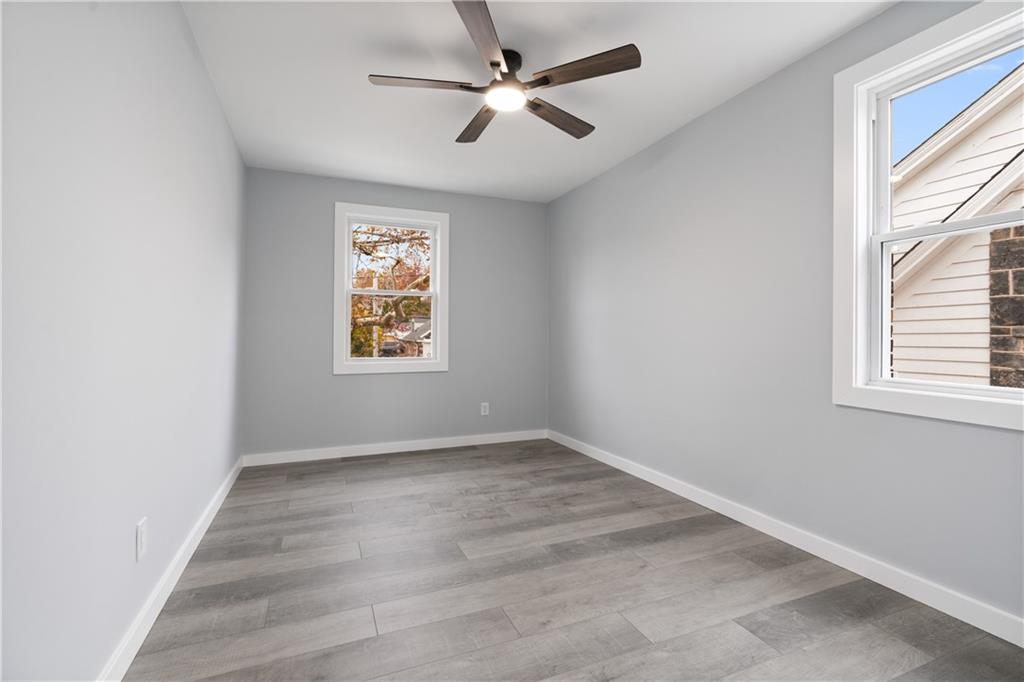 3030 Shady Avenue Pittsburgh, PA 15217 - Photo 18 of 31 wooden floor in an empty room with a window