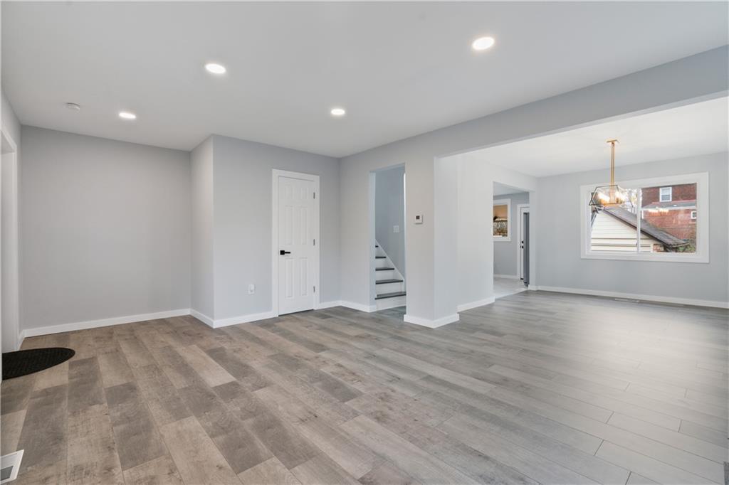 3030 Shady Avenue Pittsburgh, PA 15217 - Photo 5 of 31 an empty room with wooden floor and windows
