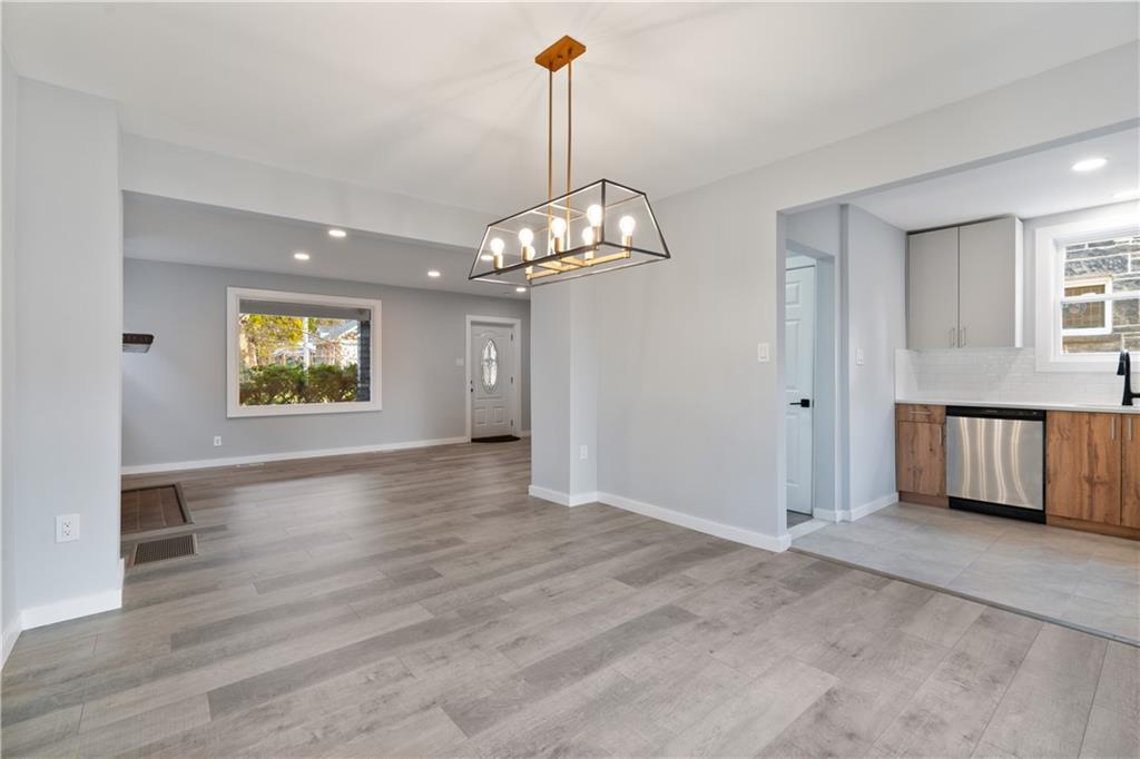 3030 Shady Avenue Pittsburgh, PA 15217 - Photo 9 of 31 an empty room with wooden floor cabinet and windows