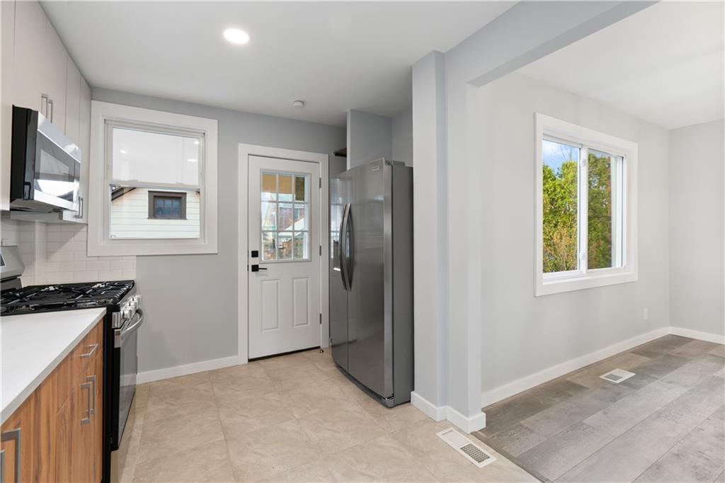 3030 Shady Avenue Pittsburgh, PA 15217 - Photo 10 of 31 a view of a kitchen and an empty room and window