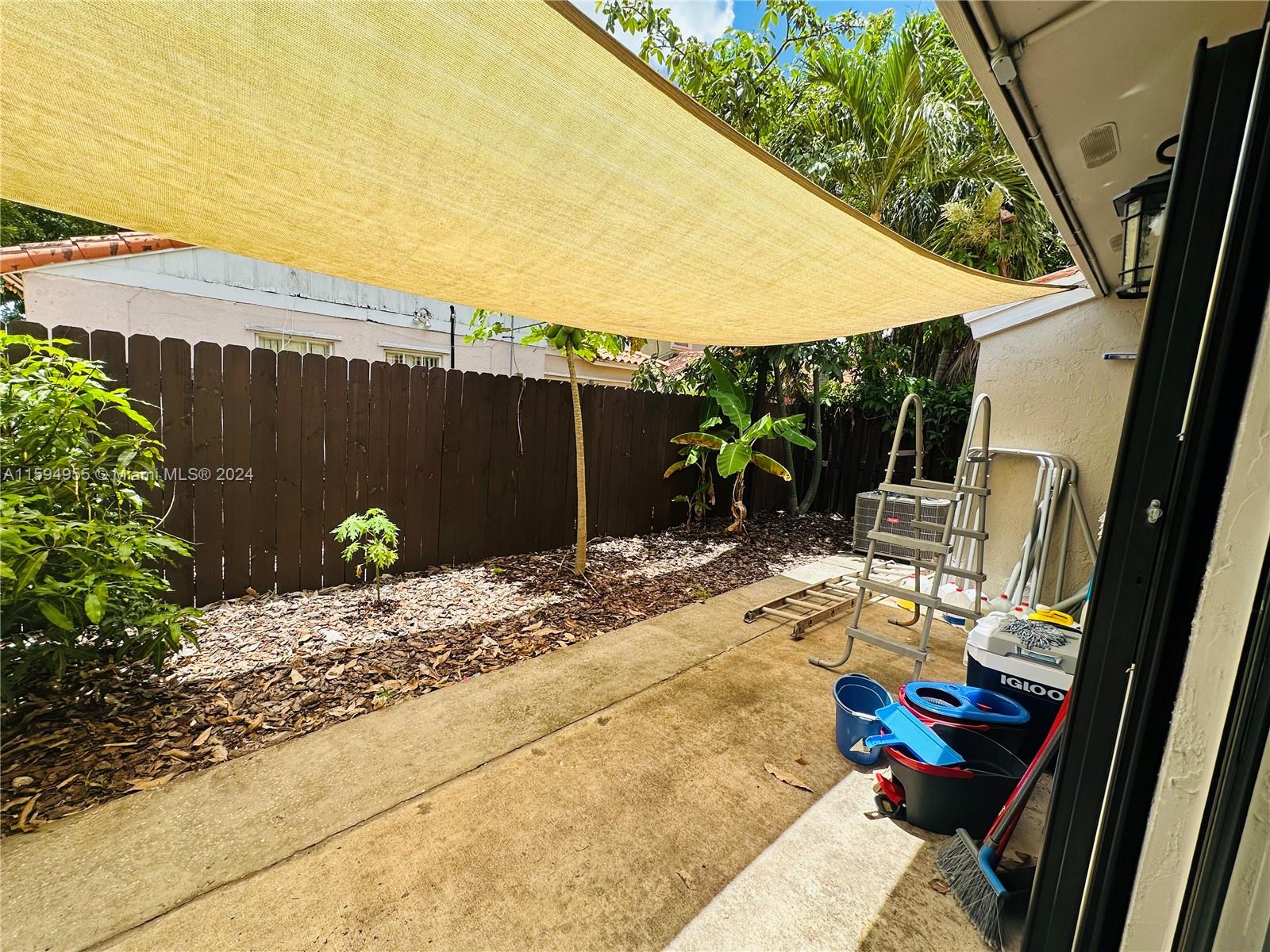 15056 Southwest 127th Place Miami, FL 33186 - Photo 17 of 25 a view of a backyard with sitting area