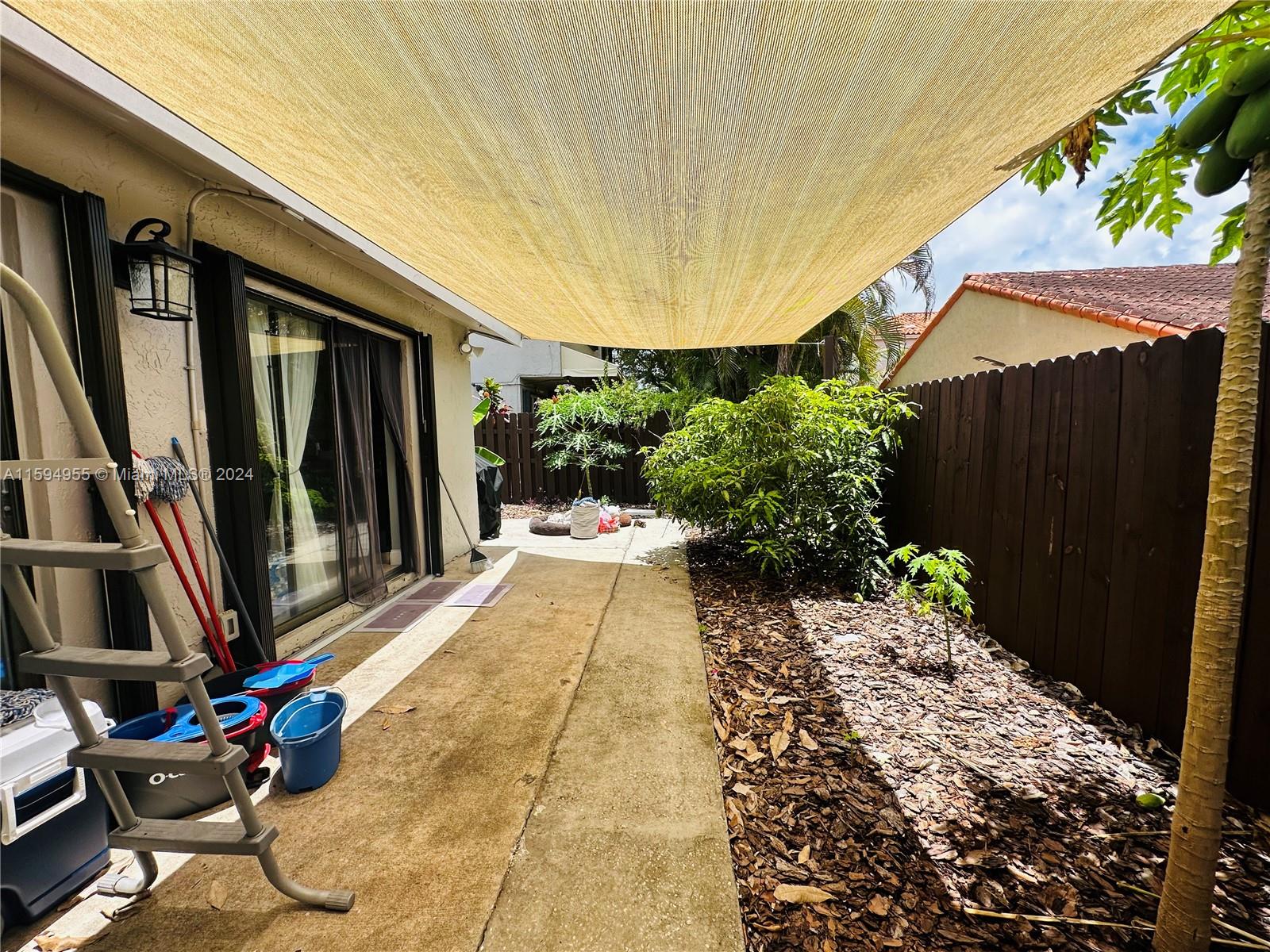 15056 Southwest 127th Place Miami, FL 33186 - Photo 18 of 25 a view of a backyard with potted plants