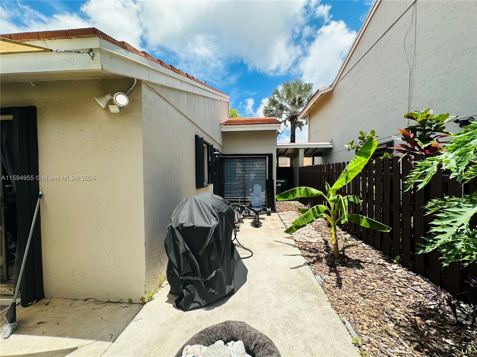 15056 Southwest 127th Place Miami, FL 33186 - Photo 20 of 25 a house view with a seating space