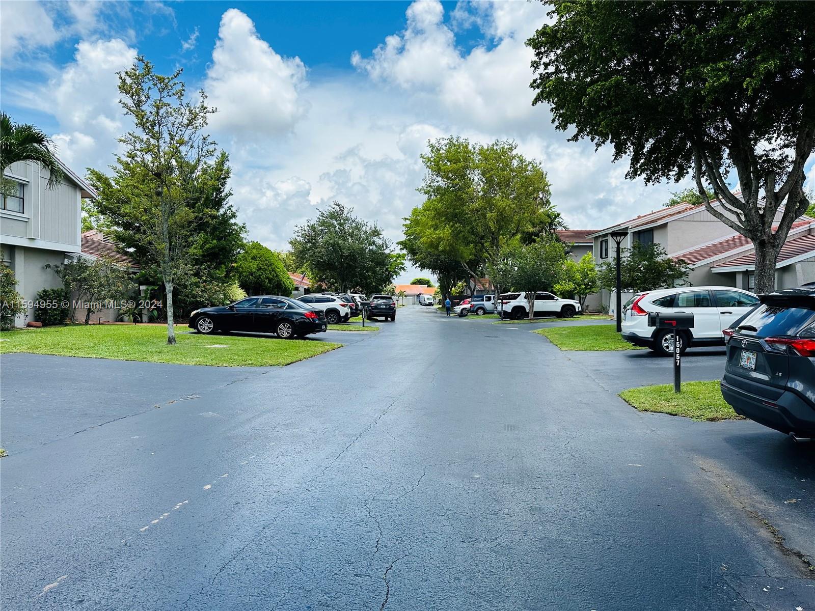 15056 Southwest 127th Place Miami, FL 33186 - Photo 21 of 25 a view of street with parked cars