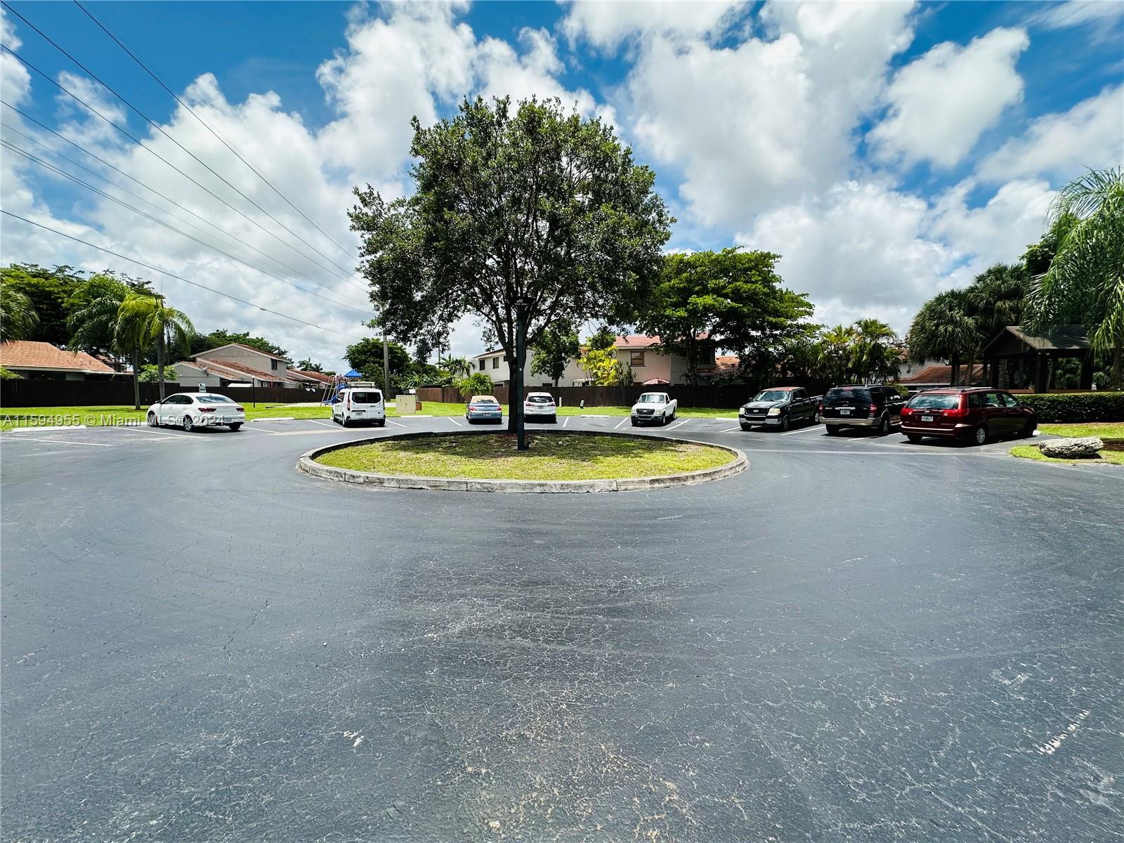 15056 Southwest 127th Place Miami, FL 33186 - Photo 23 of 25 a view of yard with swimming pool and trees in the background