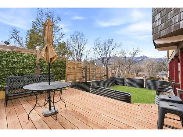 a view of outdoor space with garden and lots of trees