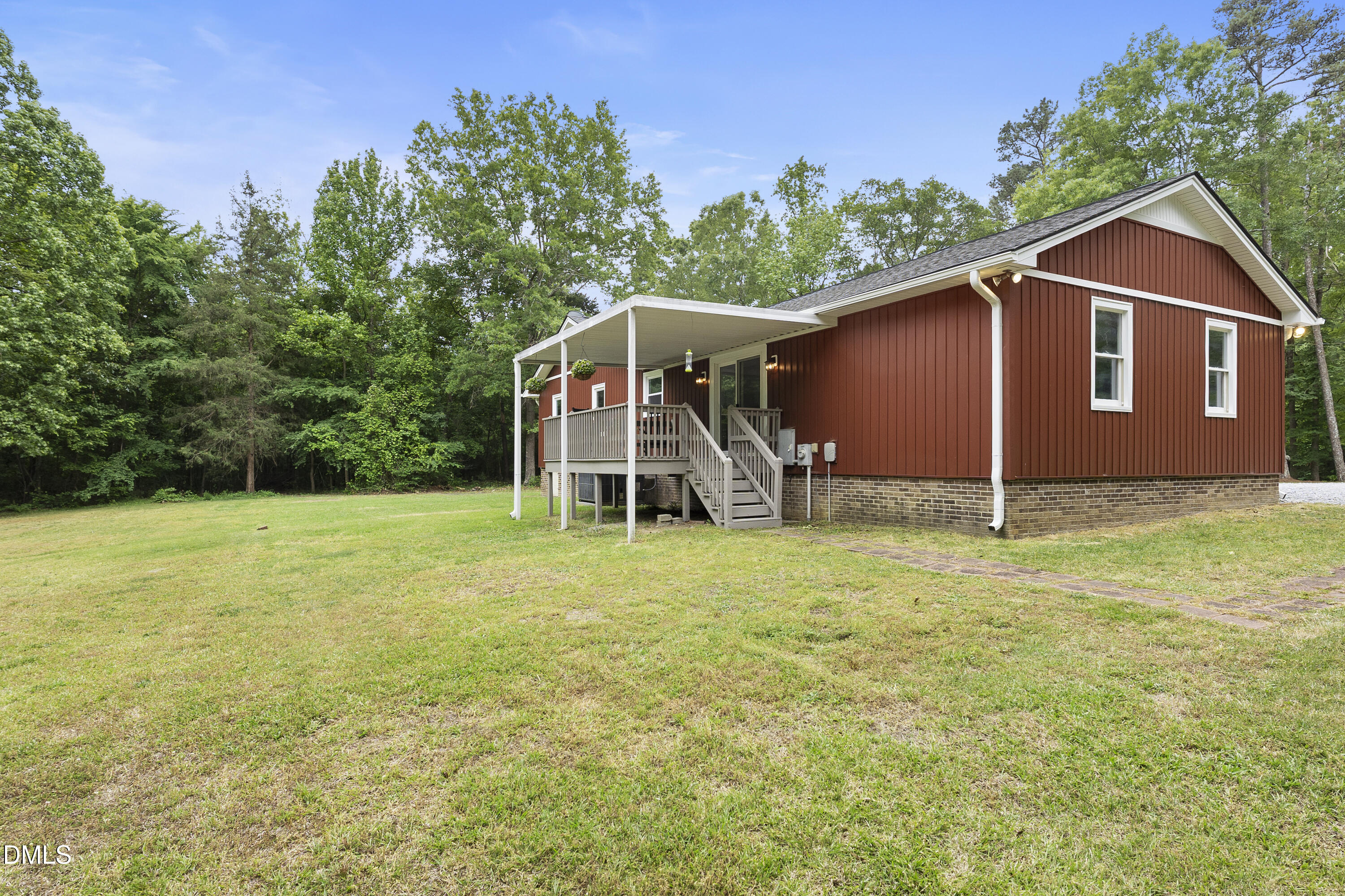 2168 Lakewood Falls Road Goldston, NC 27252 - Photo 24 of 30 a view of a tiny house with a yard