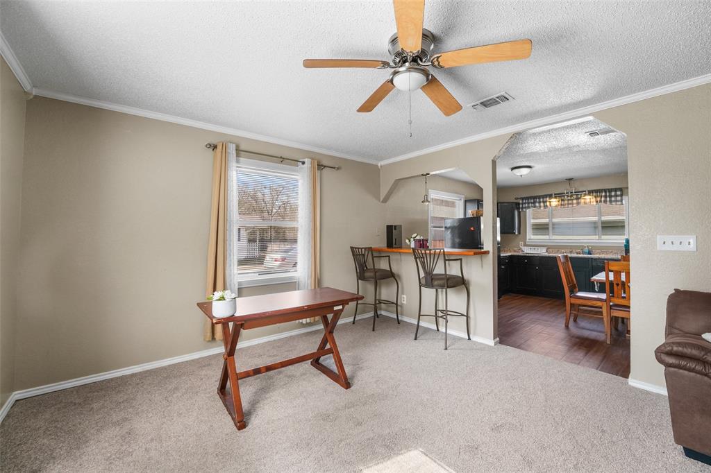 1145 Jefferson Road Paris, TX 75460 - Photo 9 of 17 a living room with furniture a ceiling fan and a window
