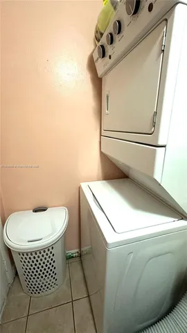 a bathroom with a toilet and a mirror