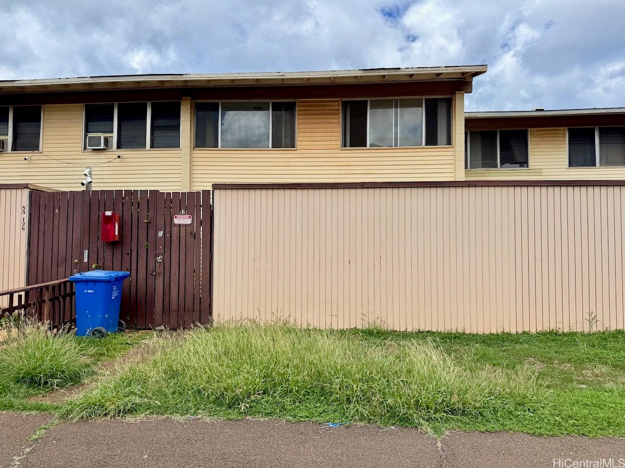 85-128 Ala Walua Street, Unit B Waianae, HI 96792 - Photo 1 of 16 a view of a house with a backyard