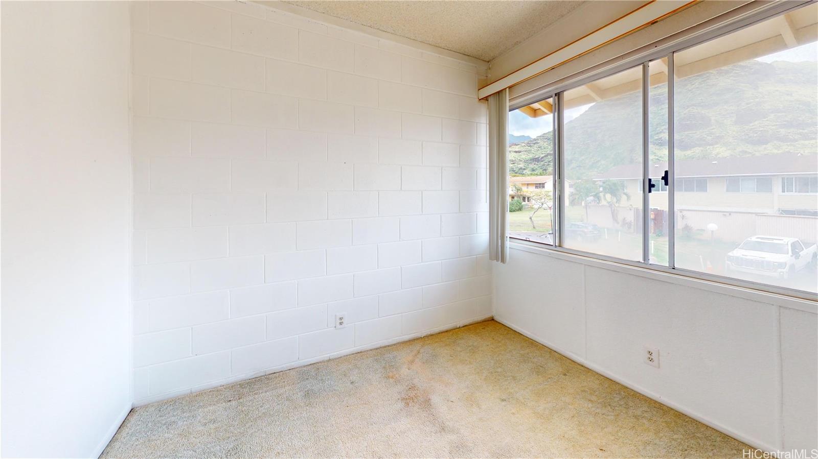 85-128 Ala Walua Street, Unit B Waianae, HI 96792 - Photo 12 of 16 a view of a room with a window