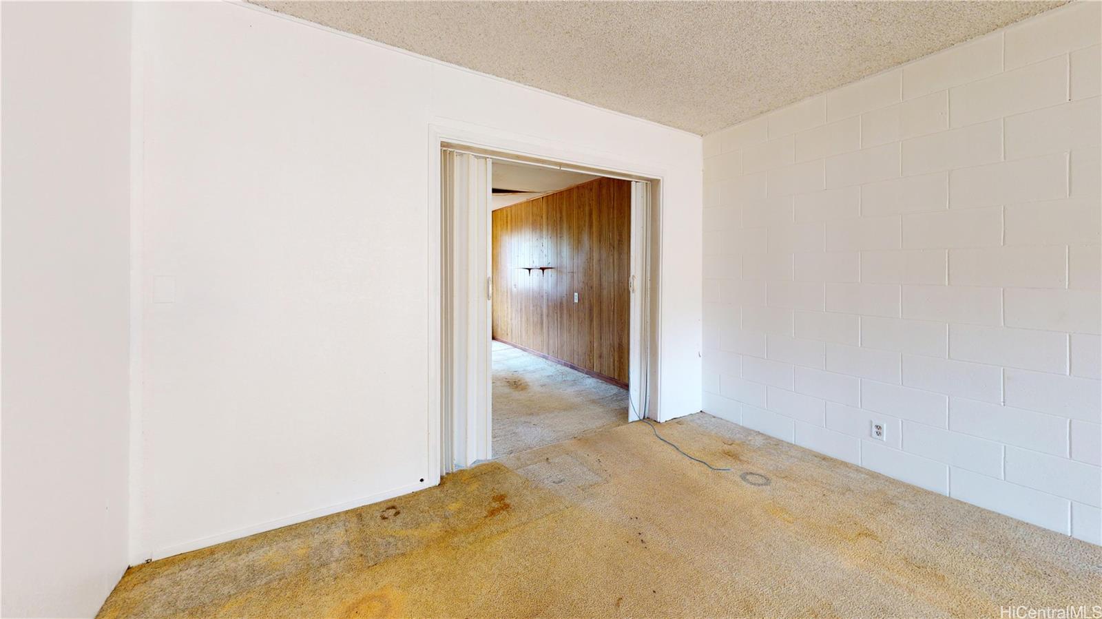85-128 Ala Walua Street, Unit B Waianae, HI 96792 - Photo 16 of 16 a view of a hallway with closet