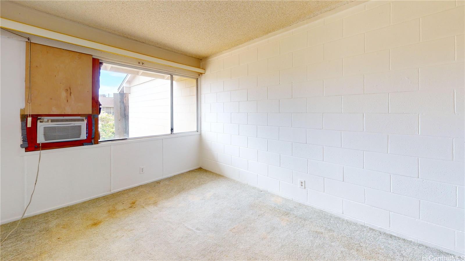 85-128 Ala Walua Street, Unit B Waianae, HI 96792 - Photo 8 of 16 a view of an empty room with a window