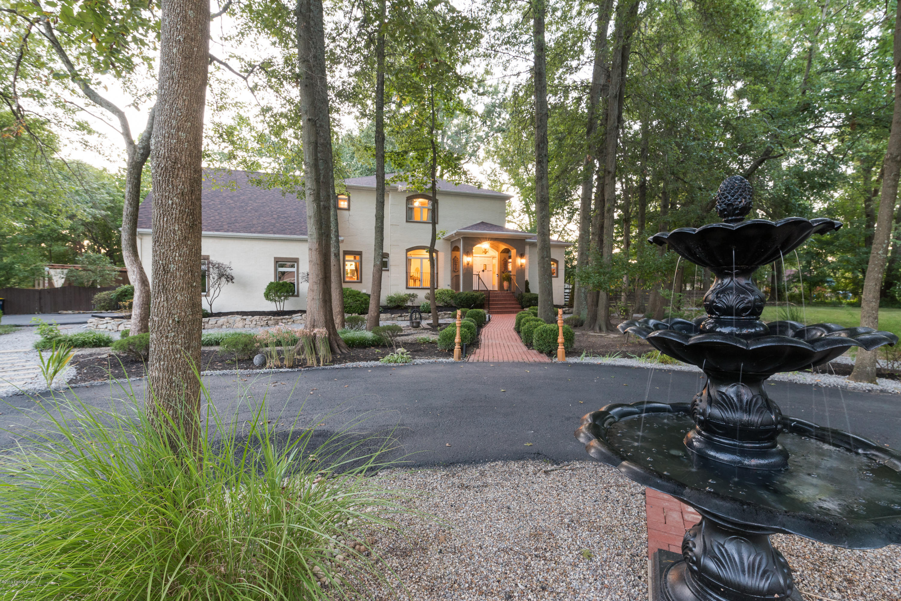11511 Cedardale Road Anchorage, KY 40223 - Photo 39 of 99 As you approach the home, your eyes will immediately be drawn to the fountain, landscape lighting, and elegant arched portico which frames a freshly painted, wood French doorway and updated exterior light fixtures.
