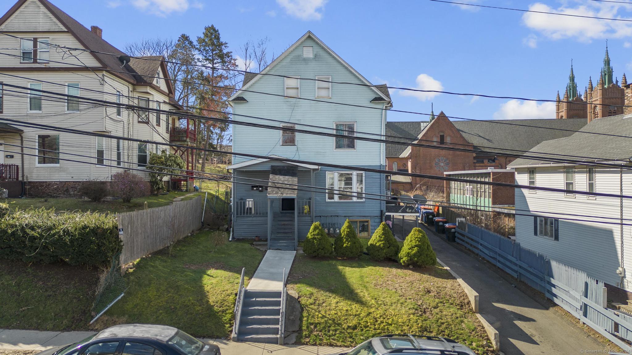 167 Liberty Street Meriden, CT 06450 - Photo 1 of 1 a view of a house with backyard and sitting area