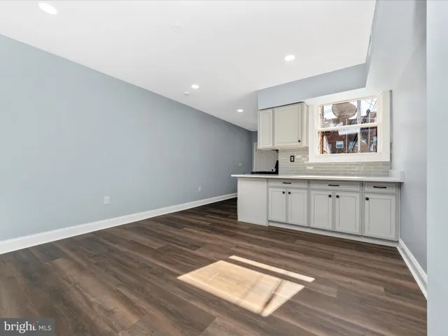 a view of a kitchen with a sink
