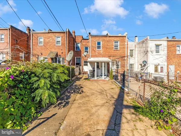 a view of a building next to a yard