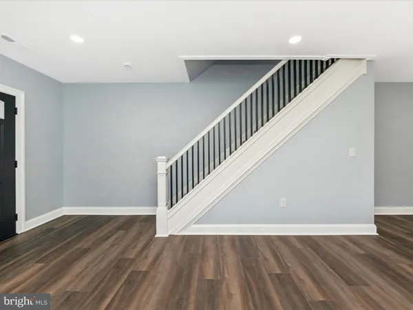a view of entryway with wooden floor