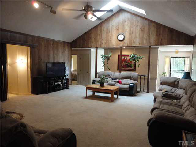 5005 Robinwood Road Durham, NC 27713 - Photo 6 of 6 a living room with furniture and a flat screen tv