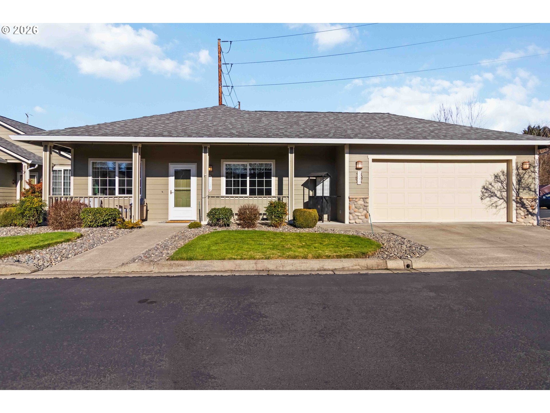 5558 Solo Point Drive Longview, WA 98632 - Photo 1 of 40 a front view of a house with a yard and garage