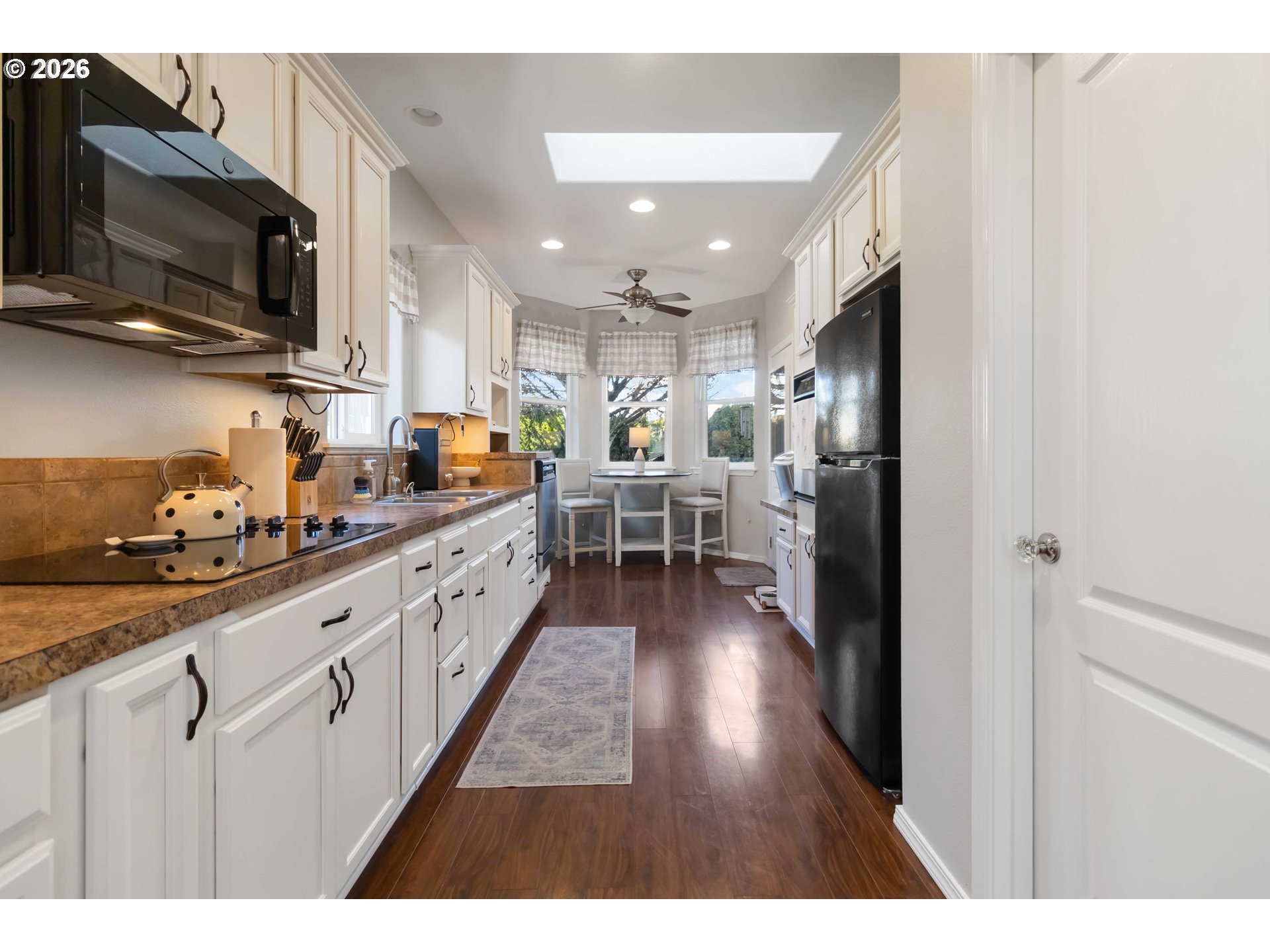 5558 Solo Point Drive Longview, WA 98632 - Photo 16 of 40 a open kitchen with cabinets a sink and a stove