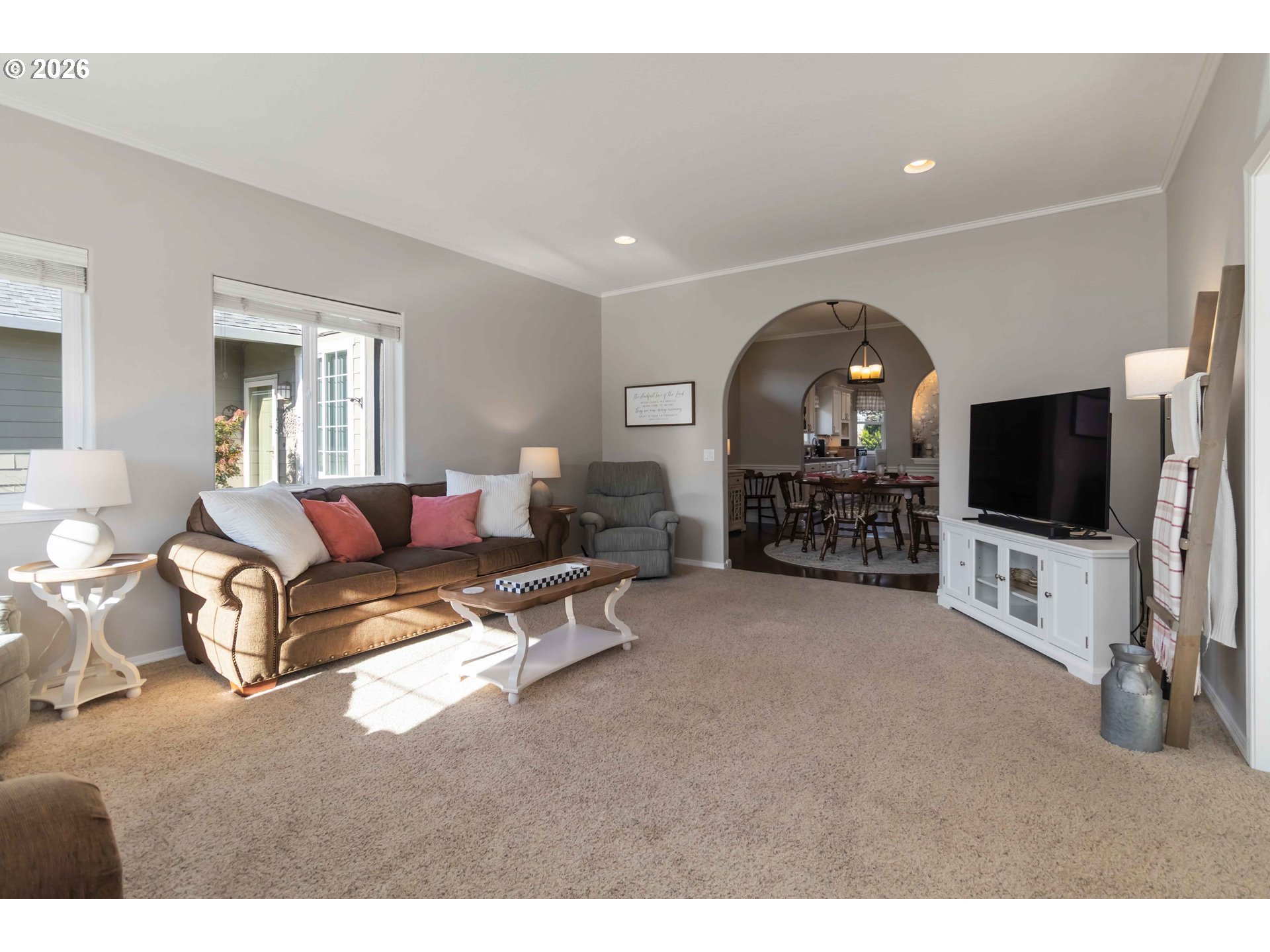 5558 Solo Point Drive Longview, WA 98632 - Photo 7 of 40 a living room with furniture a flat screen tv and a fireplace