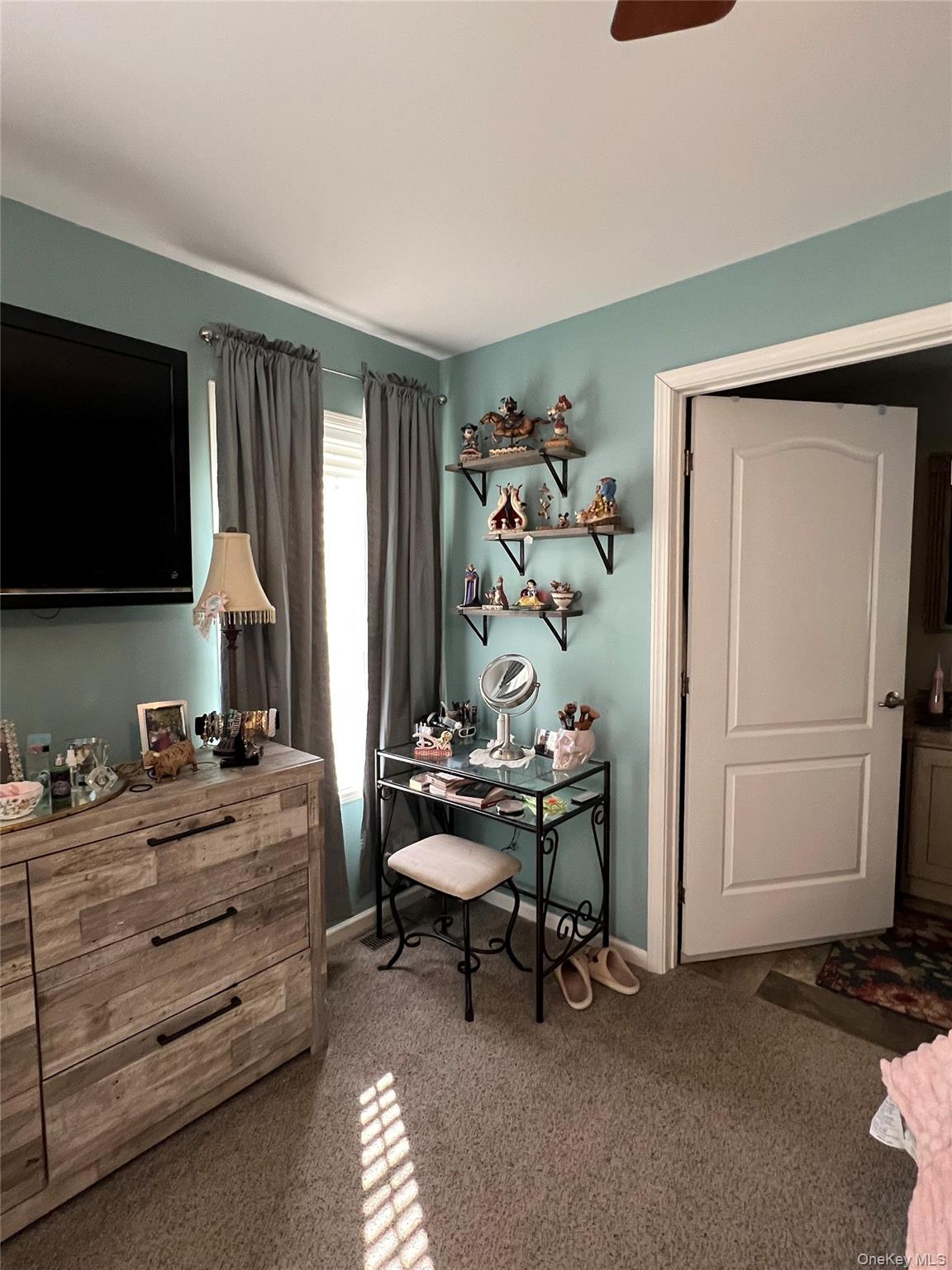 71 Midway Road Liberty, NY 12758 - Photo 12 of 23 a bedroom with a bed and a television in it