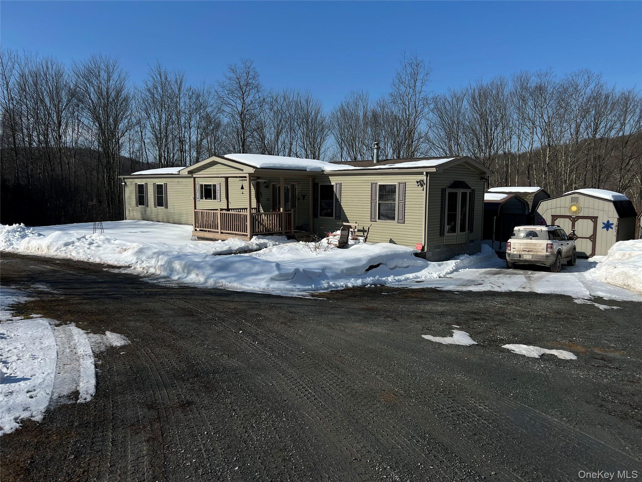 71 Midway Road Liberty, NY 12758 - Photo 2 of 23 a house with trees in the background